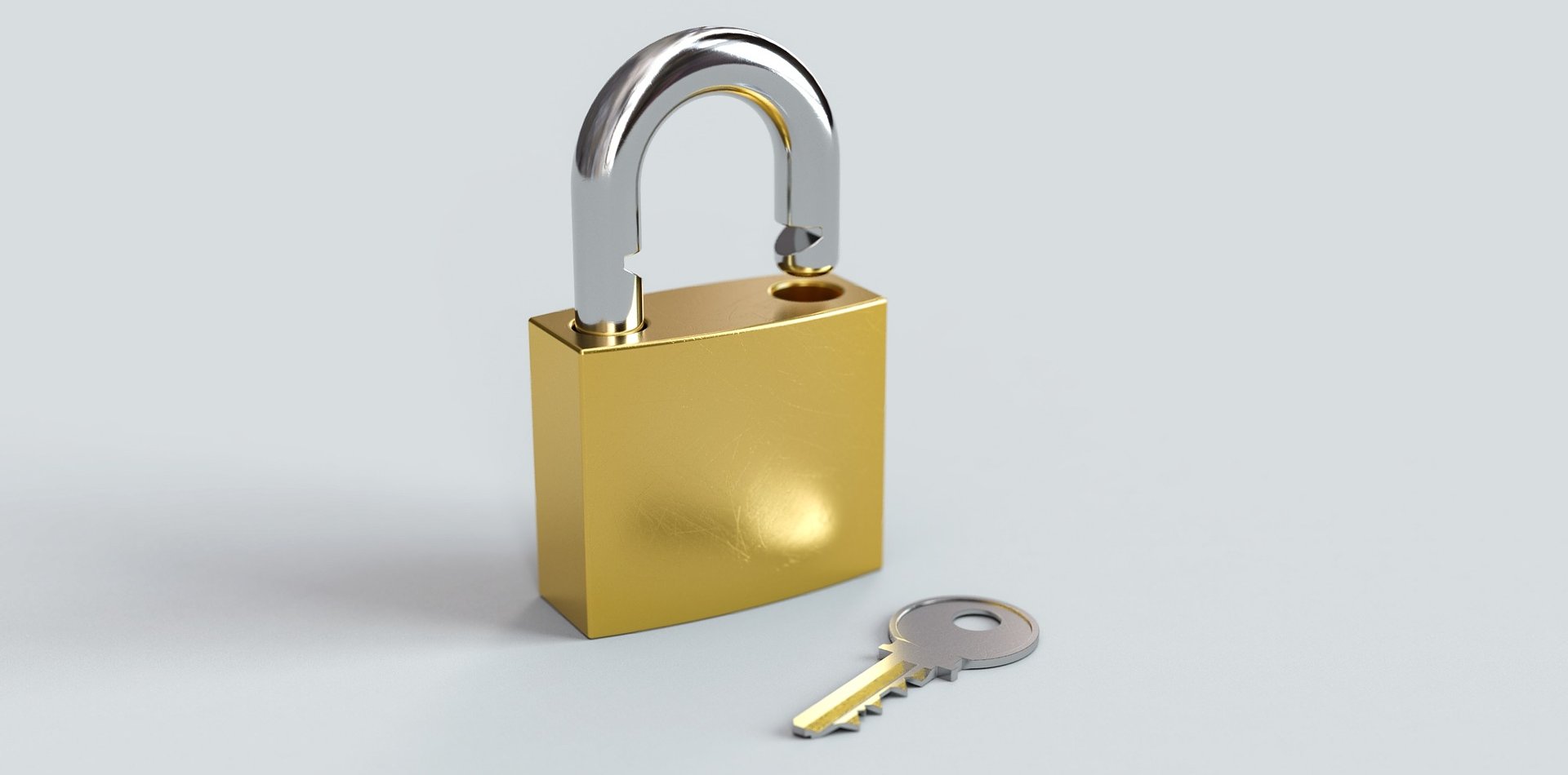 An open padlock and a key