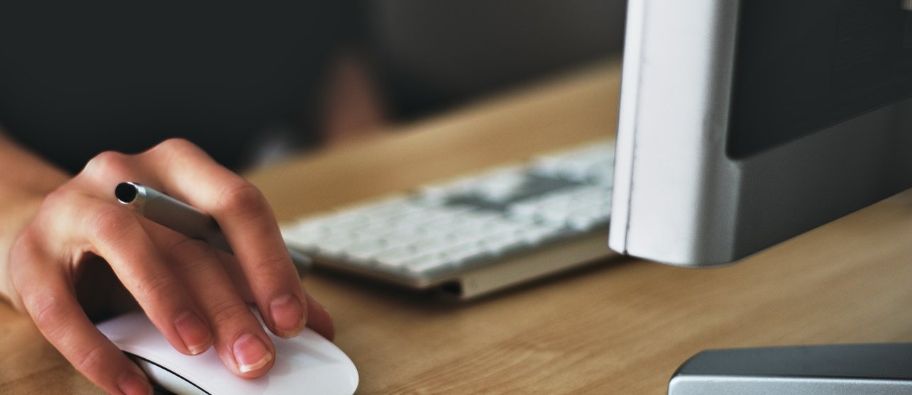 Hand on a computer mouse