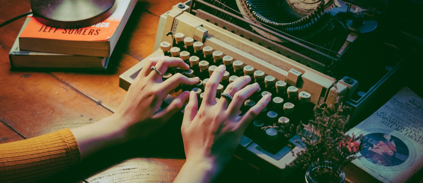 Two hands and a typewriter