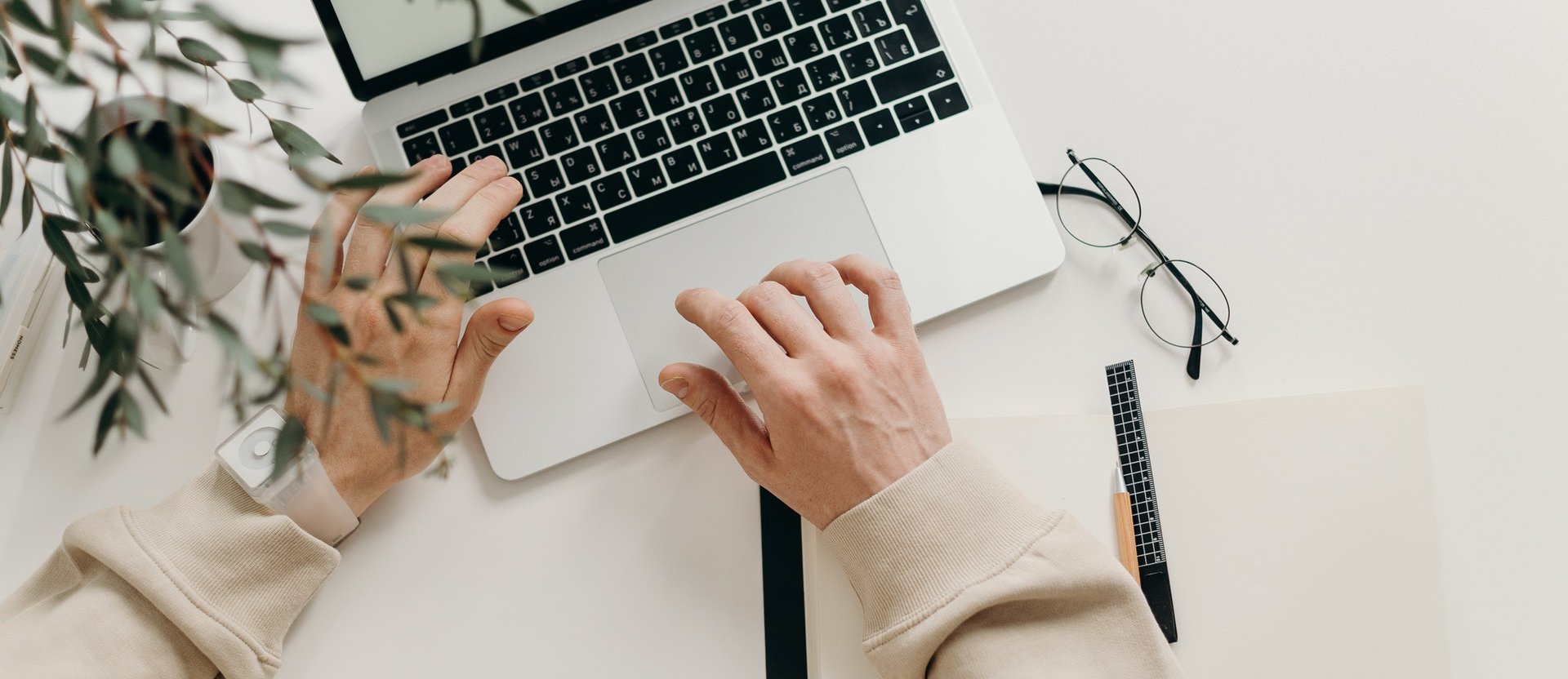 Hands on a laptop