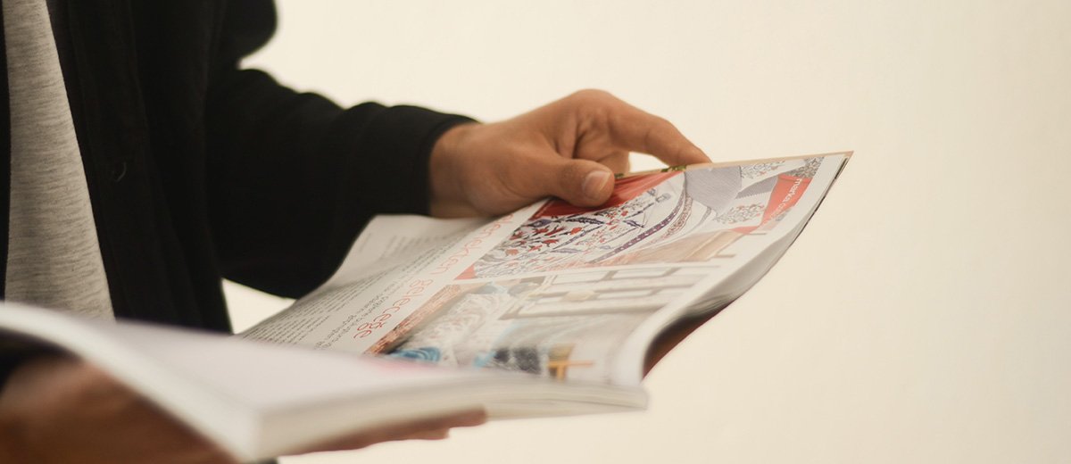 A person reading a magazine