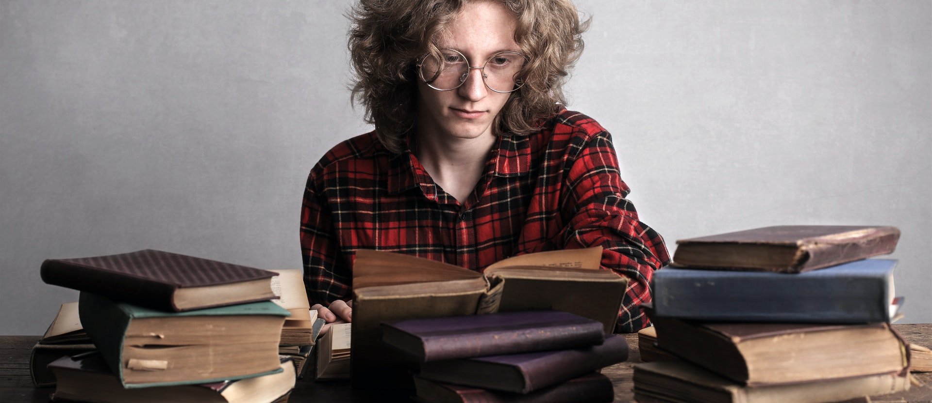 A person reading old books