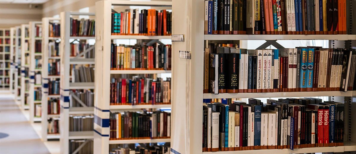 Library shelves with books 