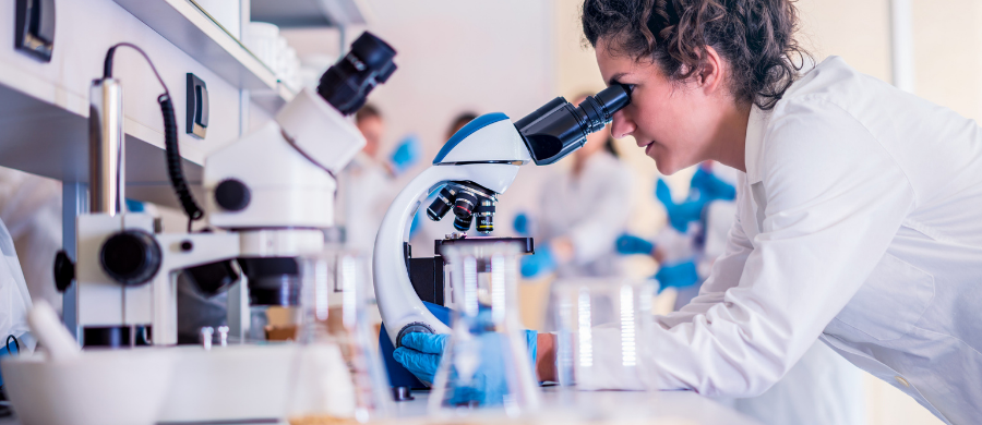  A scientist looking at the microscope