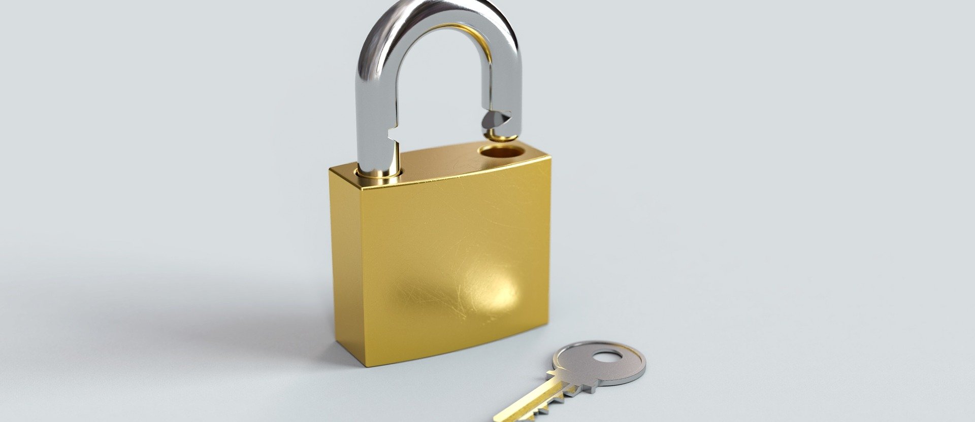 An open padlock and a key