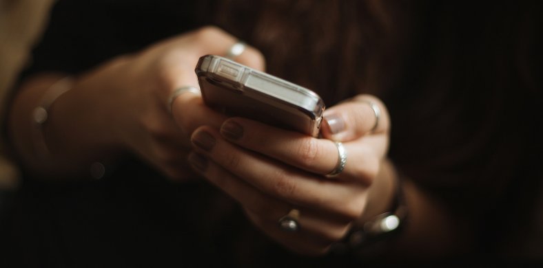 A person checking the mobile
