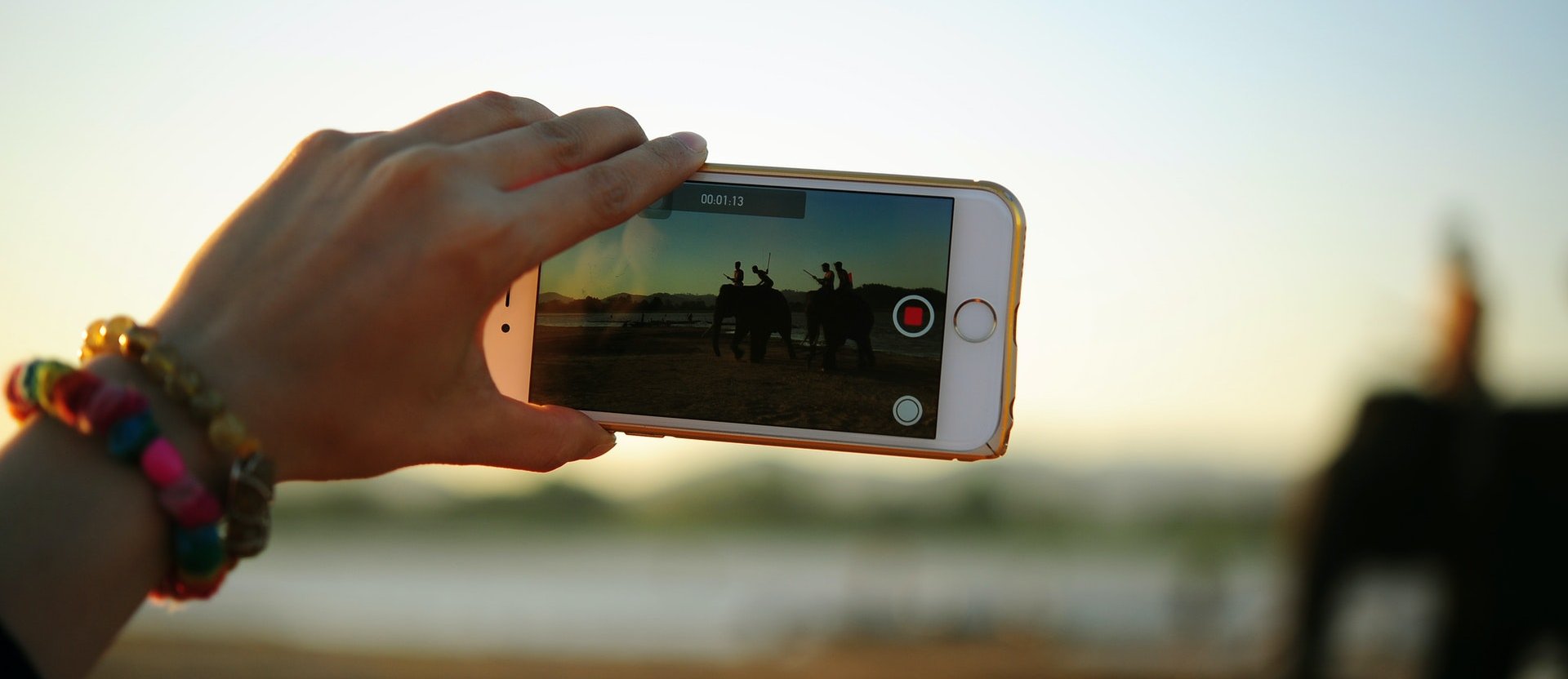 A person recording with a phone