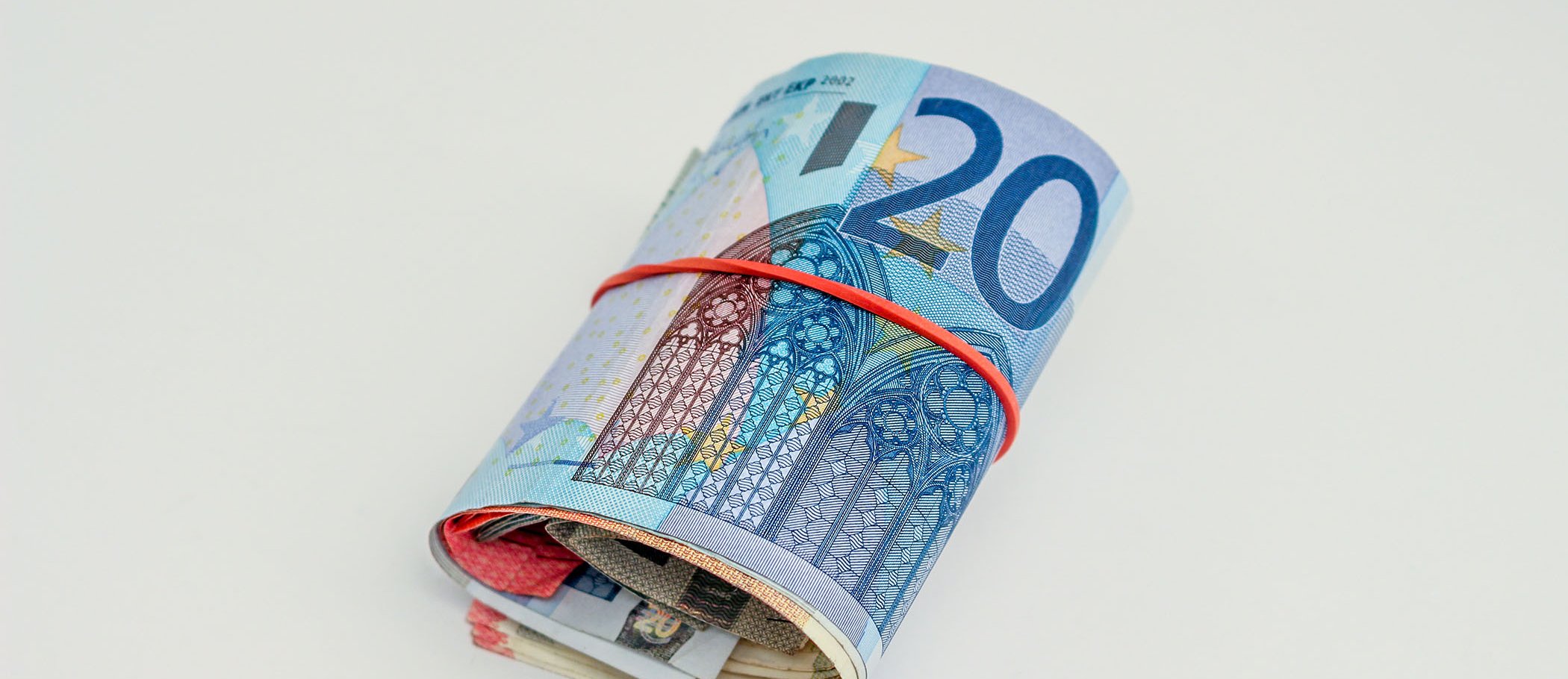 Several rolled euro banknotes