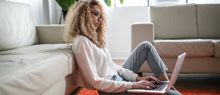 A woman sitting looking at the computer