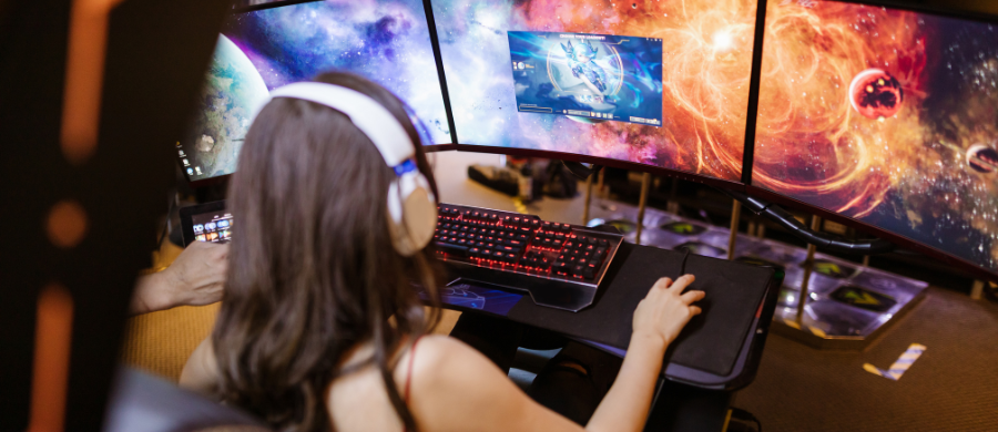 A girl playing a video game on the computer