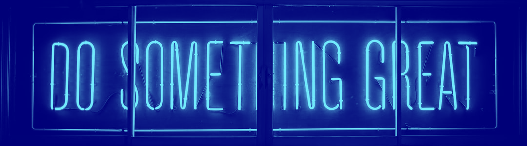 Neon sign with the quote "Do Something Great"