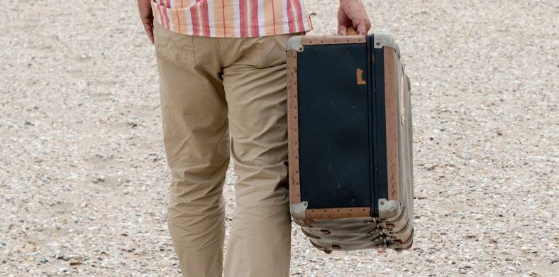 A person with a suitcase