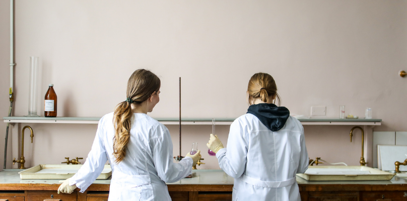 Two girls doing experiments in a laboratory